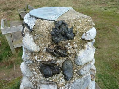 Viewpoint compass pillar on Beeston Heath with iron slag incorporated into the masonry.